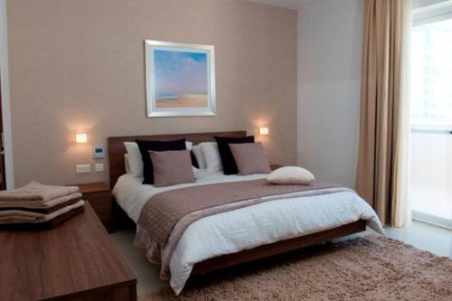 Ένα ή περισσότερα κρεβάτια σε δωμάτιο στο Quisisana Apartments - Cast Renting