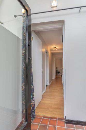 a hallway with a glass door leading into a room at Templepatrick family home beside the Rabbit hotel in Templepatrick