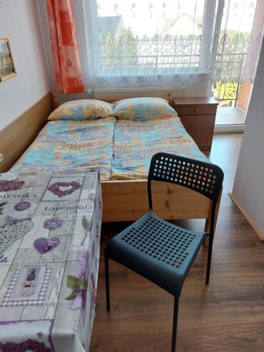 Ένα ή περισσότερα κρεβάτια σε δωμάτιο στο Pokoje Gościnne Róża