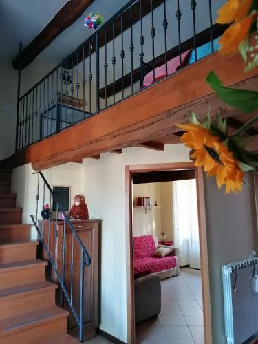 a staircase in a house with a stair case at La Girandola in Soriano nel Cimino