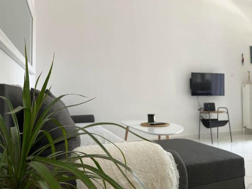 a living room with a couch and a table at House in Diavata, Thessaloniki, Greece in Thessaloniki