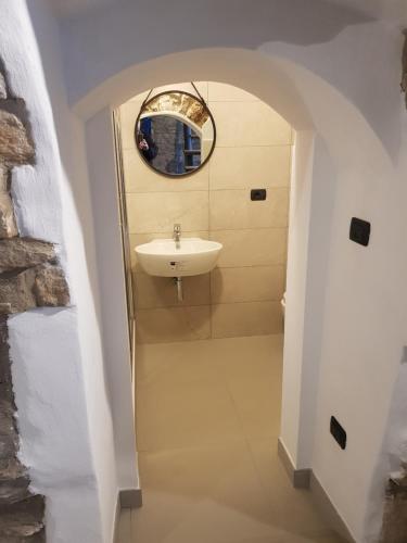 a bathroom with a sink and a mirror at Casa Vacanze Faeto in Faeto