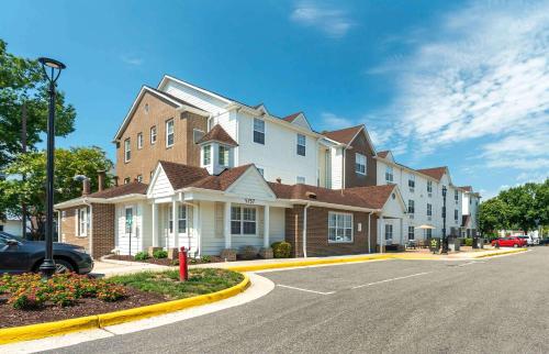 a large house on the side of a street at Extended Stay America Suites - Norfolk - Virginia Beach in Virginia Beach