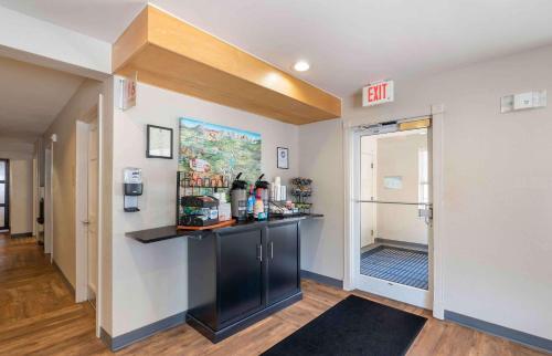 a room with a counter and a door with a exit at Extended Stay America Suites - Norfolk - Virginia Beach in Virginia Beach