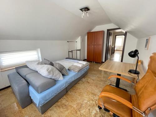 a living room with a couch and a table at Marble Apartament in Zamość