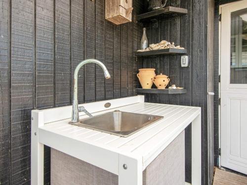 a kitchen counter with a sink on a wall at 6 person holiday home in Lemvig-By Traum in Lemvig