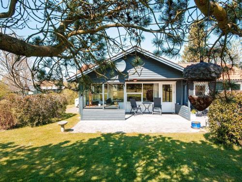 a house with a porch and a patio at 6 person holiday home in Glesborg in Glesborg