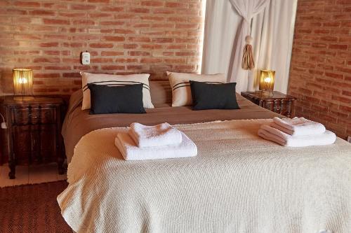 En eller flere senge i et værelse på Posada del Paraíso-Exclusivo adultos