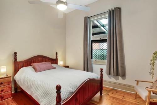 a bedroom with a bed and a window at City Edge Home From Home in Keswick