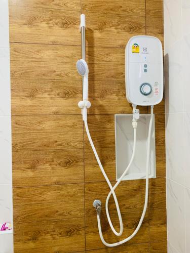 a hair dryer is attached to a wall at Suanvadee Resort สวนวดี รีสอร์ท in Don Sak