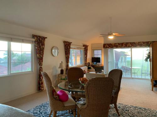 a living room with a table and chairs at Ko Olina Ocean View Home Office in Kapolei