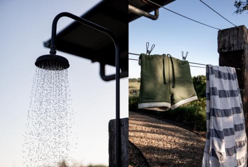 a pair of gloves hanging on a clothes line at Carinya Byron Bay in Hayters Hill