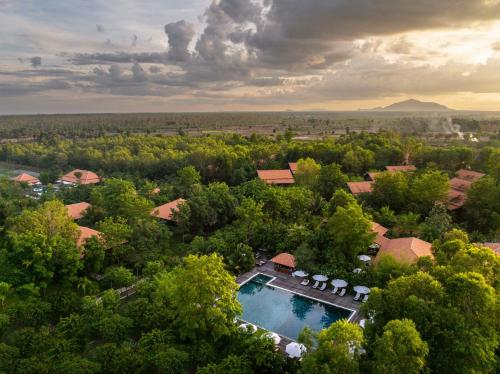 an aerial view of a house with a swimming pool at Farmhouse Resort & Spa in Kampong Chhnang