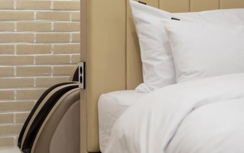 a bed with white sheets and a white pillow at Hotel Yaja Gwangalli in Busan
