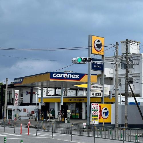 a gas station with a traffic light in front of it at Tommy Condominium WAKASA301 in Kume