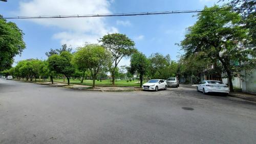 two cars parked on the side of a street at Robin House in Hue