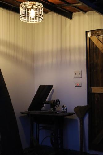 a laptop computer sitting on a desk in a room at Thom's House in Ninh Binh