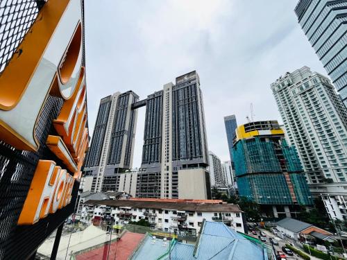 a city skyline with tall buildings in a city at Prime Hotel at TRX Tower in Kuala Lumpur