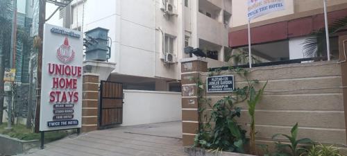 a building with signs on the side of it at UNIQUE HOMESTAYS in Kondapur