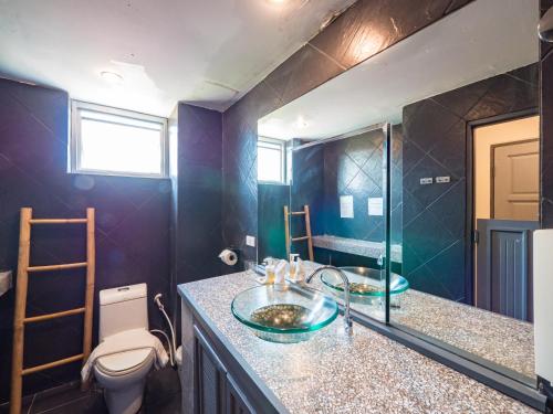 a bathroom with a sink and a toilet at Lemon House apartment in Mae Nam