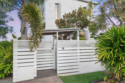 a white fence with a gate in front of a house at Scarborough Beach Break Holidays - Unit 3 in Scarborough
