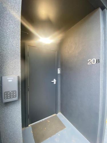a door in a room with sign next to it at Location location: Melbourne street views in Adelaide
