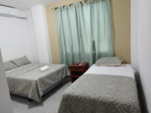 Postel nebo postele na pokoji v ubytování Casa D'Lucas