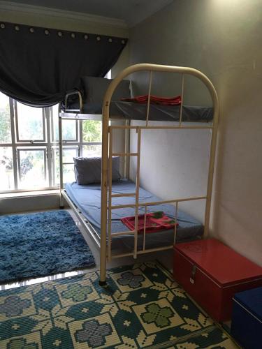 Llit o llits en una habitació de Tiki garden