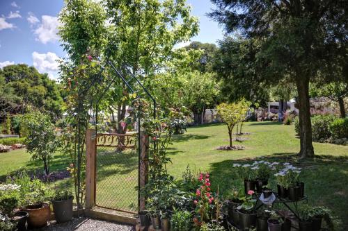 a garden with a gate and lots of plants at Yarra Gables in Healesville
