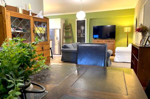 a living room with a couch and a table at Dora Hall - Very Central in Orange