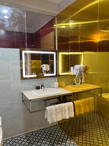 a bathroom with a sink and a mirror at Nhat Quy Hotel in Tây Ninh