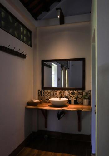 a bathroom with a sink and a mirror at Thom's House in Ninh Binh