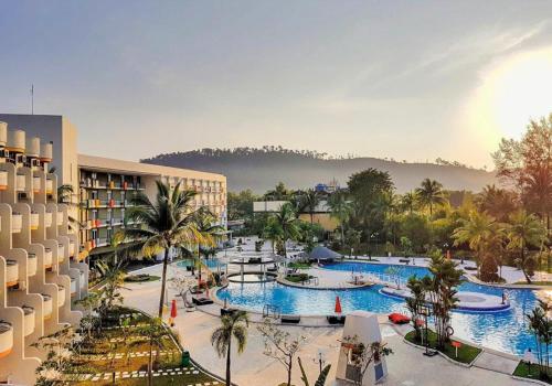 an aerial view of a resort with two pools at HARRIS Resort Batam Waterfront in Sekupang