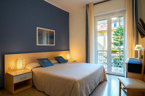Postel nebo postele na pokoji v ubytování Hotel Doria