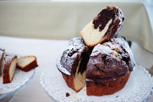 a plate with a chocolate bundt cake on it at Hotel St. Giorgio in Castel San Giorgio