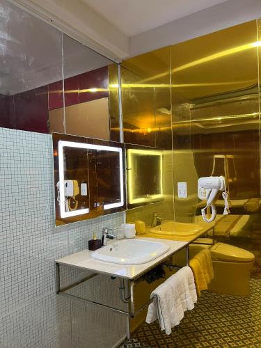 a bathroom with a sink and a mirror at Nhat Quy Hotel in Tây Ninh