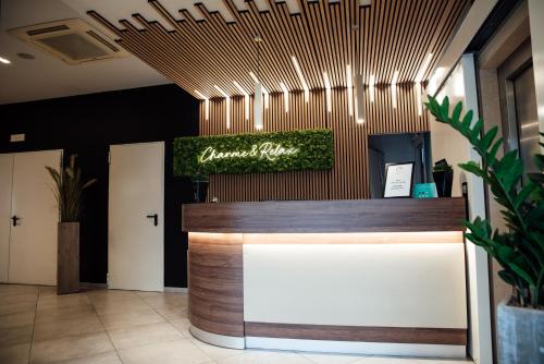 a lobby of a restaurant with a reception desk at Hotel St. Giorgio in Castel San Giorgio