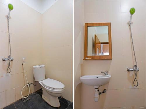 a bathroom with a toilet and a sink and a mirror at SPOT ON 92569 Anto Homestay Syariah in Nagoya