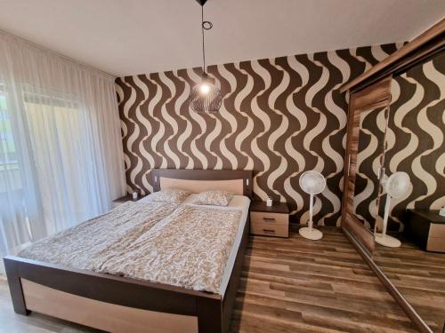Family Apartment Vadaš tesisinde bir odada yatak veya yataklar