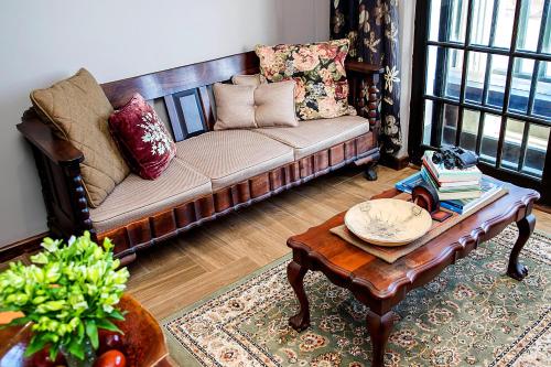 a living room with a couch and a coffee table at aHa Guest House in Sea View