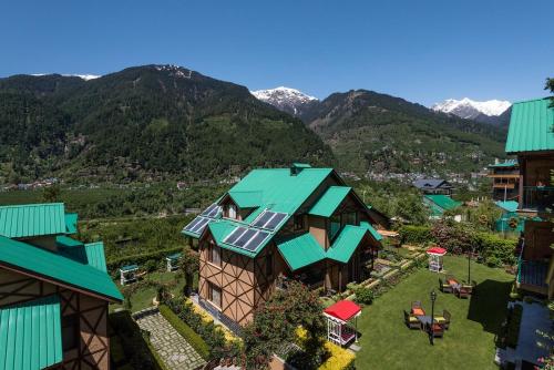 an aerial view of a house with a solar roof at The Anantmaya Resort in Manāli