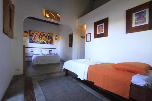 a bedroom with two beds in a room at Pousada Maresia in Atins