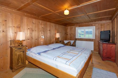 Postel nebo postele na pokoji v ubytování Haus Holzwurm