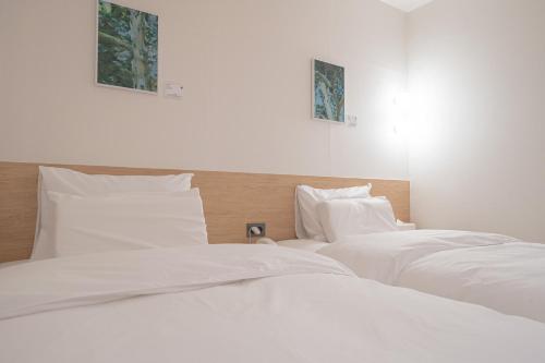 Postel nebo postele na pokoji v ubytování Aank Hotel Cheongju Uam 2nd