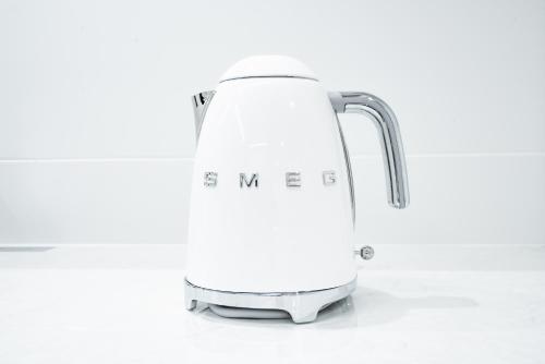 a white toaster sitting on a counter at Randor Hotel Hiroshima Prestige in Hiroshima