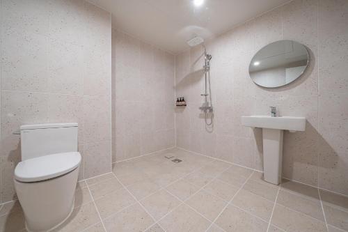 a bathroom with a toilet and a sink at Aank Hotel Daejeon Yongjeon 2nd in Daejeon