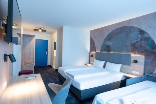 Katil atau katil-katil dalam bilik di Taste Hotel Jettingen