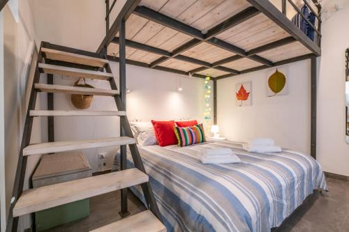 a bedroom with a bunk bed and a ladder at Super Mario Sea House by Pleiades Home in Livorno