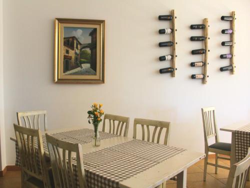 a dining room with a table and wine bottles at Tenuta Ferraro Gallipoli in Gallipoli