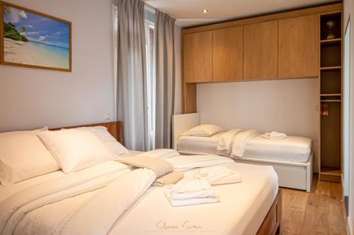 a hotel room with two beds in a room at ApartHotel Trendy by Urban Home Stay in Alkmaar